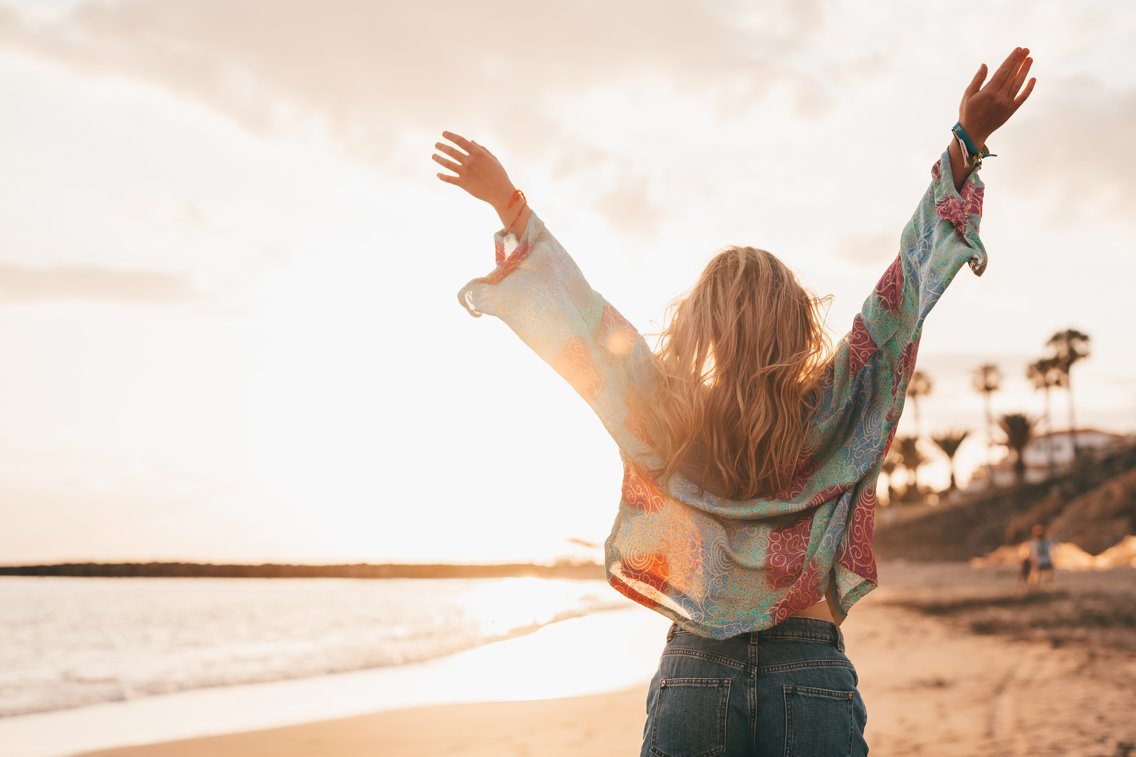 Woman with arms outreached in freedom